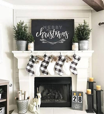 Festive Christmas mantel with plaid stockings, evergreen trees, and 'Merry Christmas' sign for cozy holiday decor