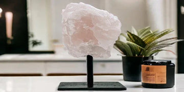 Pink crystal decor on stand with potted plant and candle, stylish home accents for Queensland interiors