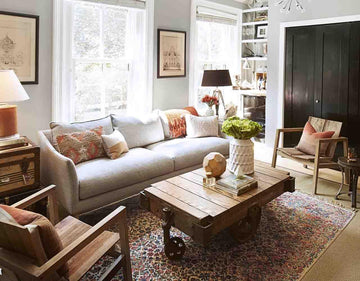Cozy living room with gray sofa, wooden coffee table, and colorful rug for home decor inspiration