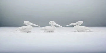 Three white pelican figurines for modern home decor, minimalist design