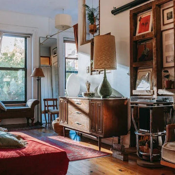 Stylish living room with vintage wooden sideboard, green lamp, and cozy red rug for home decor inspiration