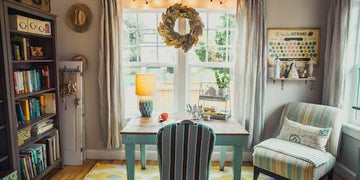 Cozy home office with striped chair, bookshelf, and wreath-adorned window, perfect for Queensland home decor