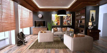 Modern living room with beige sofas, wooden floors, and wall art for stylish home decor