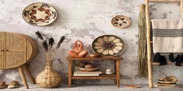 Boho home decor with woven baskets, ceramic plates, and rustic wooden shelves for stylish interiors