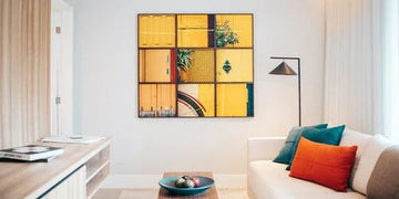 Modern living room with yellow grid wall art, cozy sofa, and stylish home decor accents