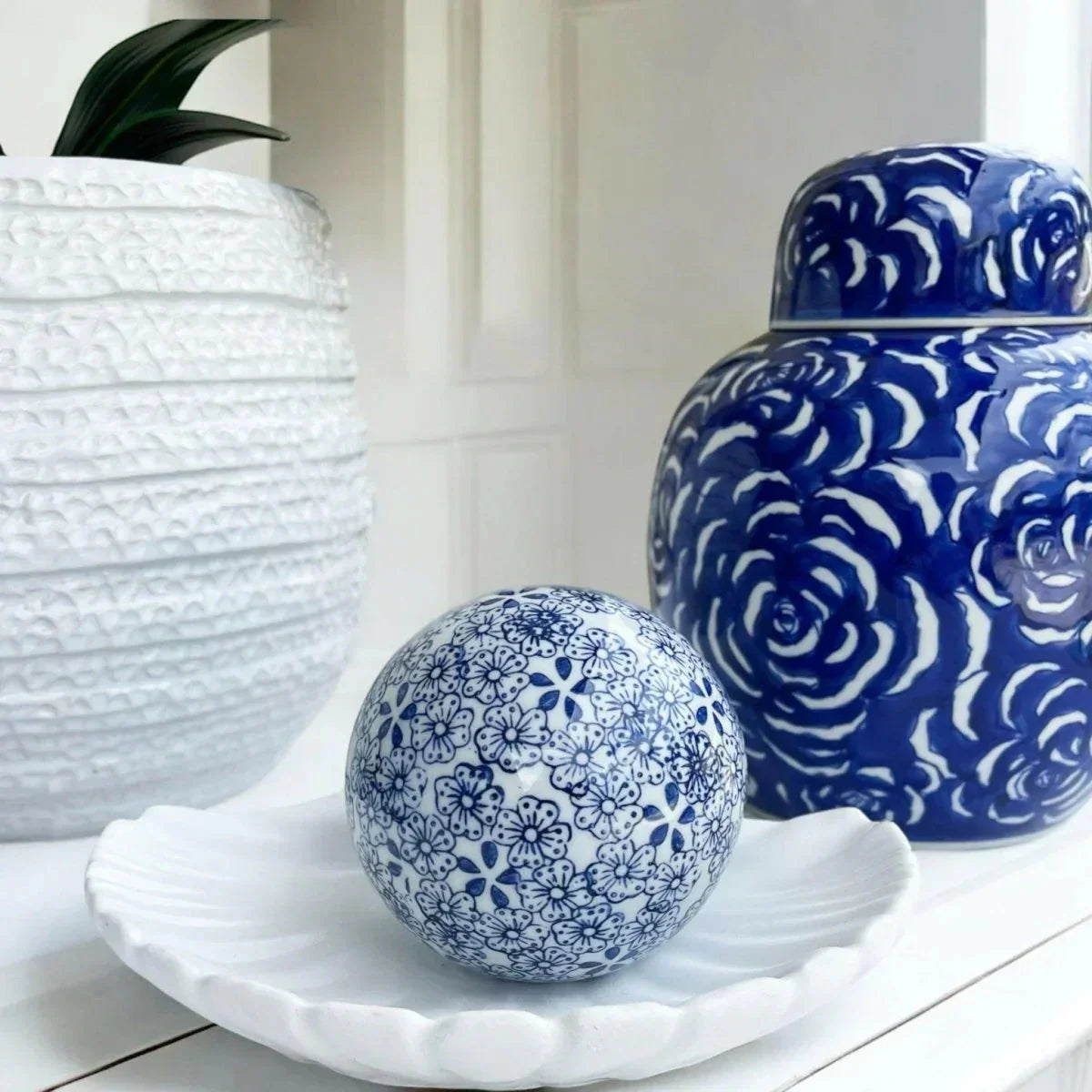 Blue and white floral decorative ball on a white dish with elegant ceramic vases, Exquisite Homewares
