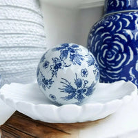 Blue and white floral ceramic deco ball on shell dish, elegant home décor accent