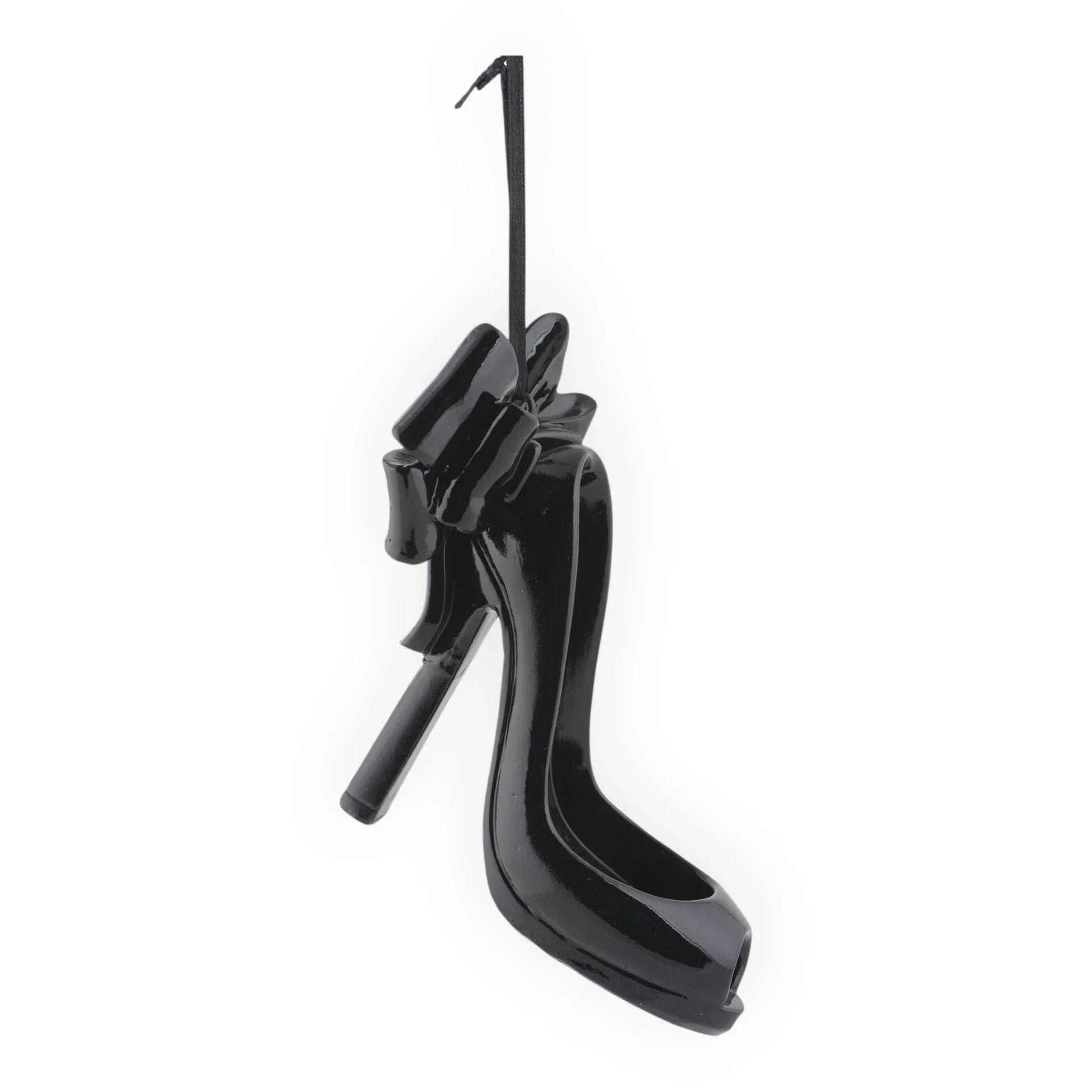 Glossy black high heel shoe ornament with bow, stylish home décor accent