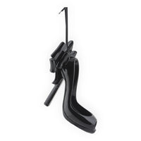 Glossy black high heel shoe ornament with bow, stylish home décor accent