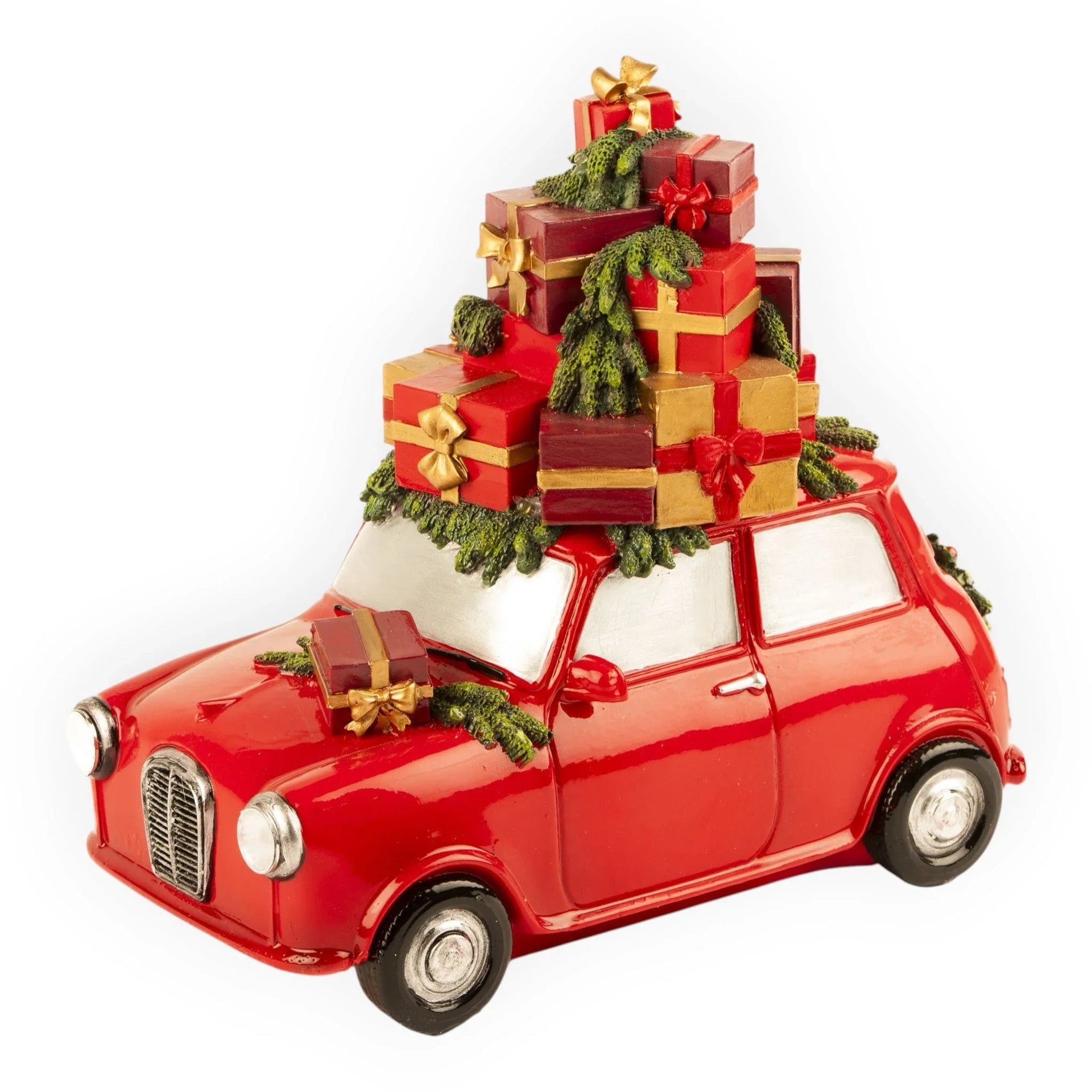Red vintage car figurine loaded with Christmas gifts and greenery, festive holiday décor