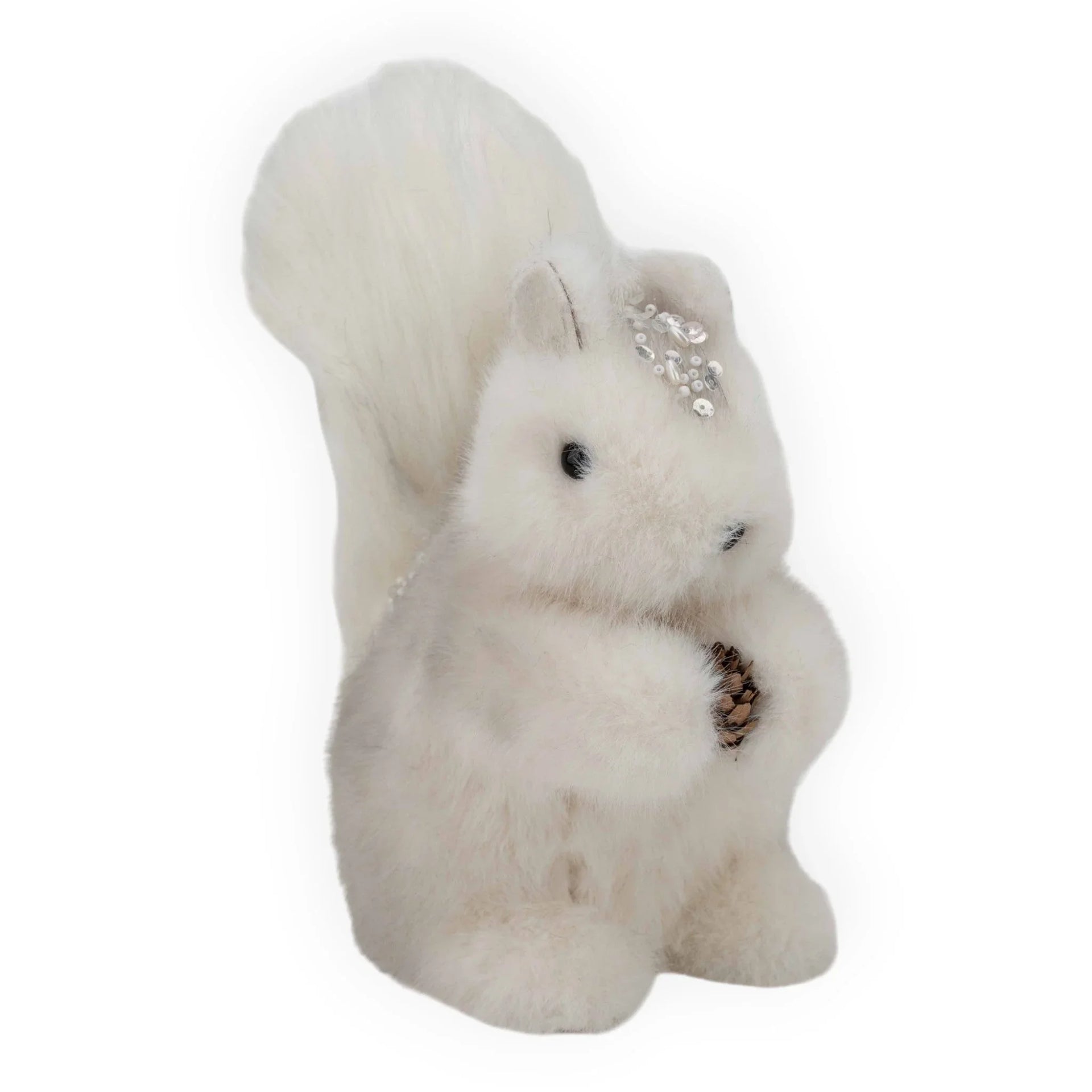 White fluffy squirrel decoration holding pinecone, adorned with pearls and sequins for festive home décor