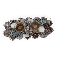 Frosted pinecone centerpiece with glittery ornaments and glass candle holders for holiday home décor