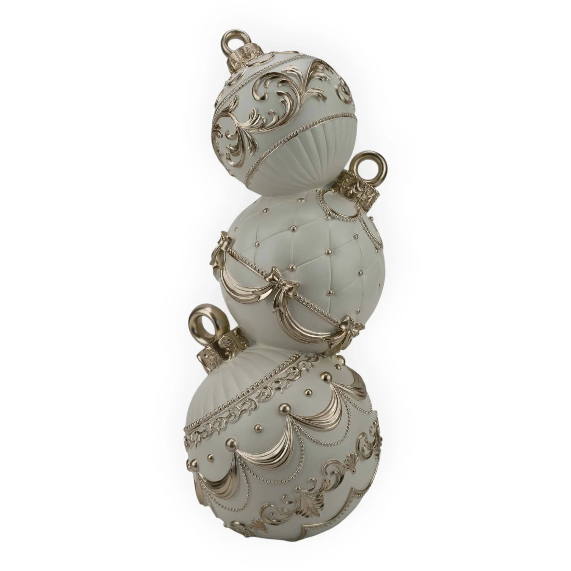 Elegant white and gold Christmas ornaments with intricate scrollwork, perfect for festive home décor