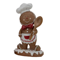 Gingerbread man chef figurine with apron and wooden spoon, festive holiday home decor