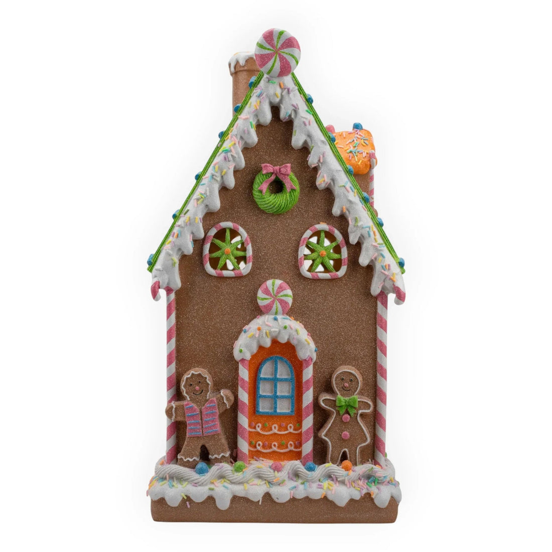 Festive gingerbread house with candy canes, sprinkles, and gingerbread figures for holiday home décor