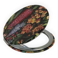 Floral compact mirror with vintage botanical print, perfect for home décor or personal accessories