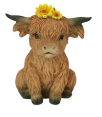 Cute Highland cow figurine with yellow flower crown, rustic home décor accent