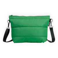 Vibrant green crossbody bag with black strap, ideal for everyday carry and travel accessories.