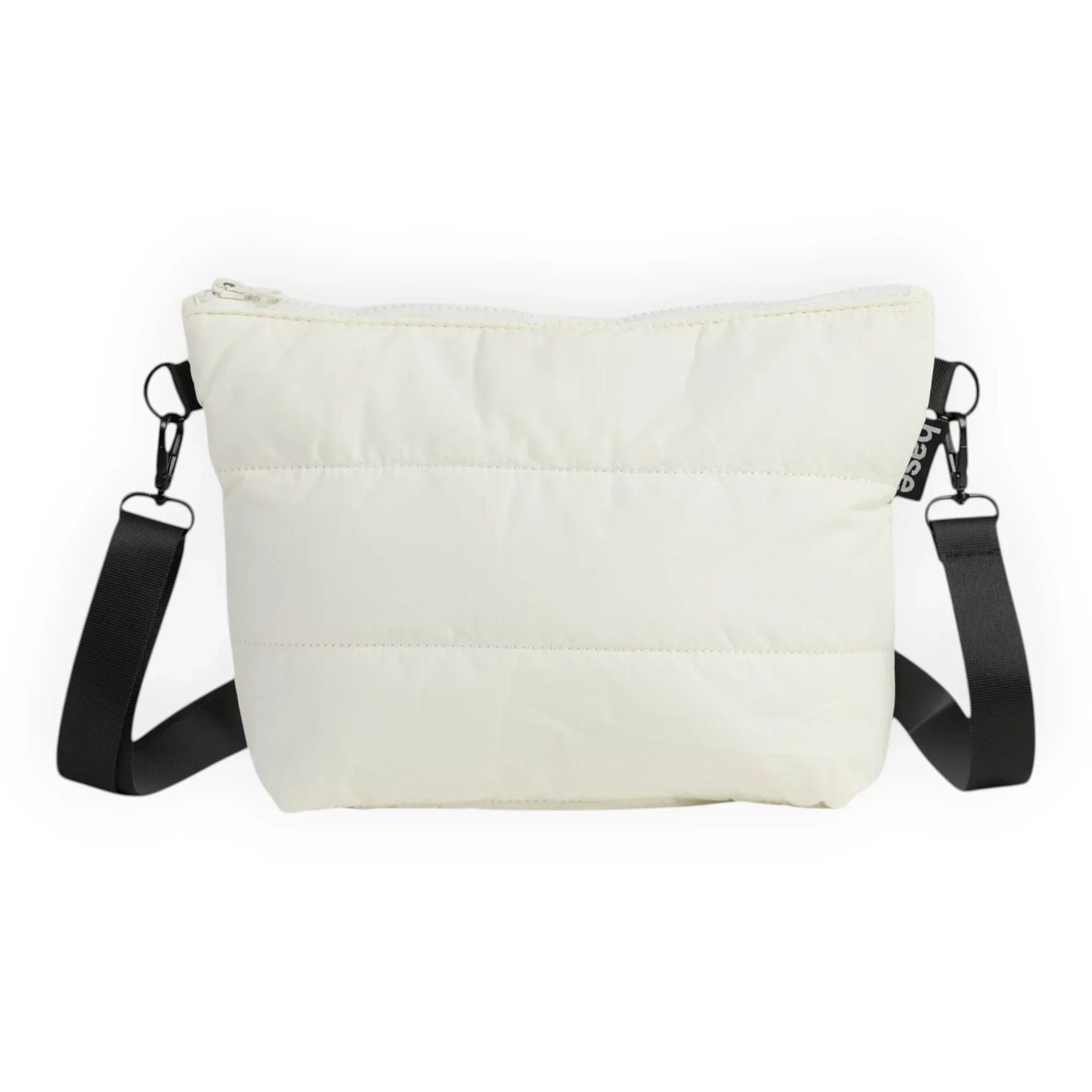 Cream quilted crossbody bag with black strap, minimalist design for everyday use