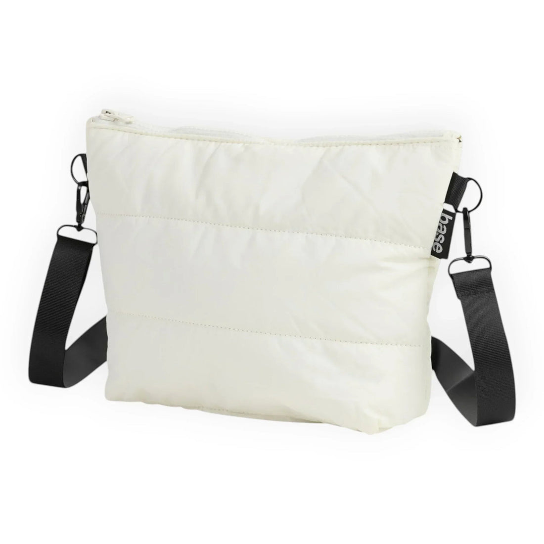 Cream quilted crossbody bag with black strap and base tag, minimalist design for everyday use