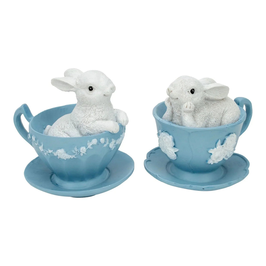 Charming white bunny figurines nestled in light blue teacups with floral details, perfect for vintage home décor.
