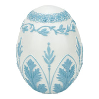 Elegant white egg with light blue floral relief, vintage home décor accent piece