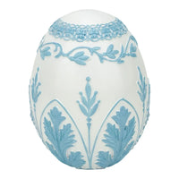 Elegant white egg with light blue floral relief, vintage home décor accent piece