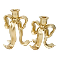 Gold bow-shaped candle holders for elegant home décor and vintage-inspired table settings