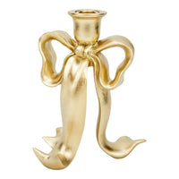 Gold bow-shaped candle holder for elegant home décor and vintage-inspired table settings