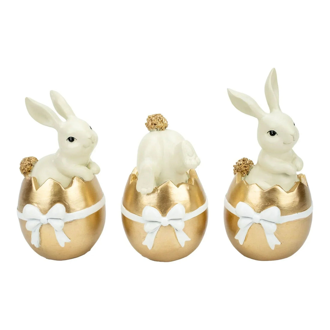 White bunny figurines in gold Easter eggs with white bows, home décor set
