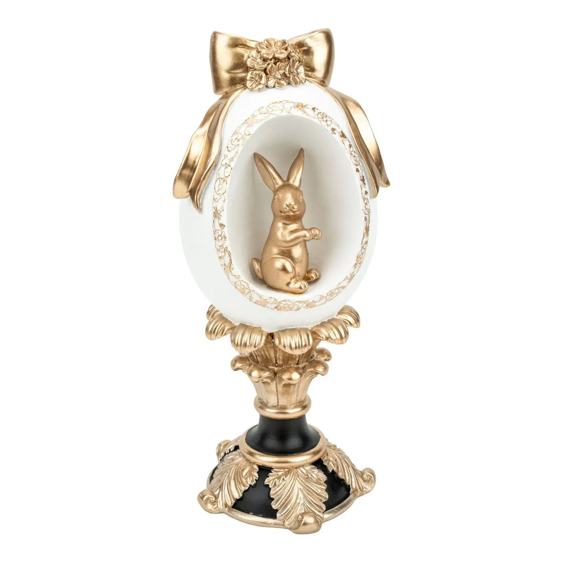 Elegant white and gold Easter egg with bunny figurine, ornate bow, and decorative pedestal for home décor