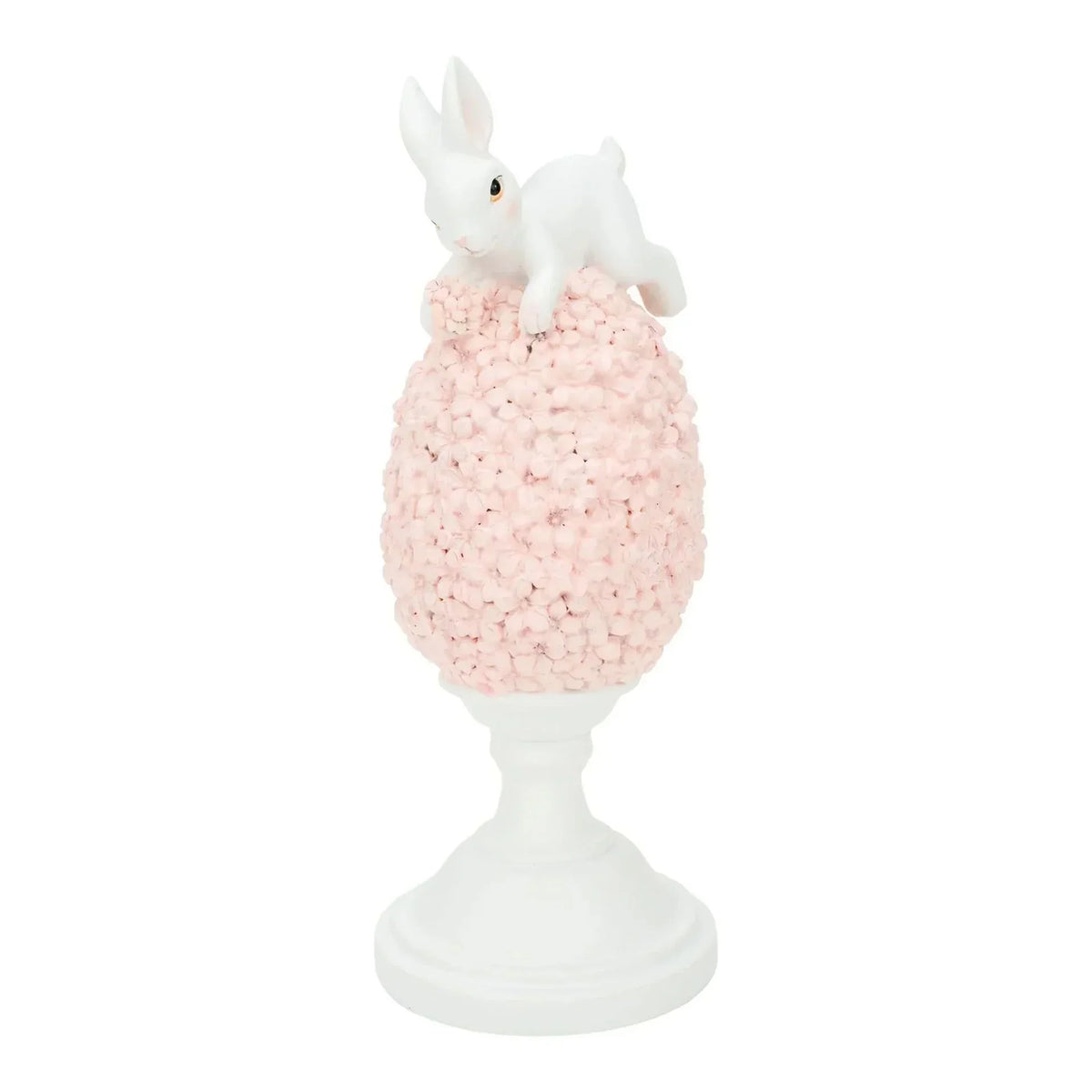 White bunny figurine perched atop pink floral egg on pedestal, elegant home décor accent piece