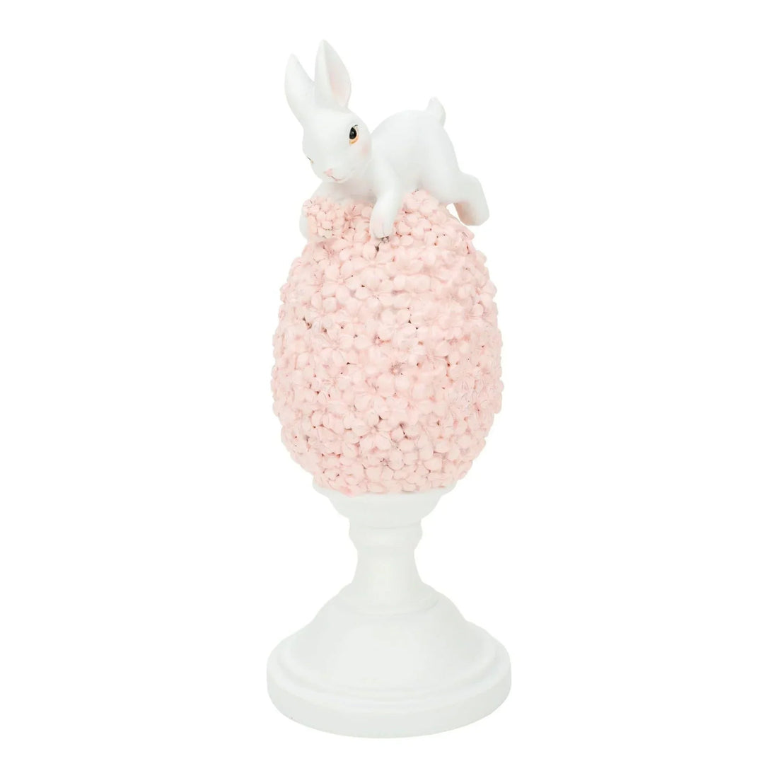 White bunny figurine perched atop pink floral egg on pedestal, elegant home décor accent piece