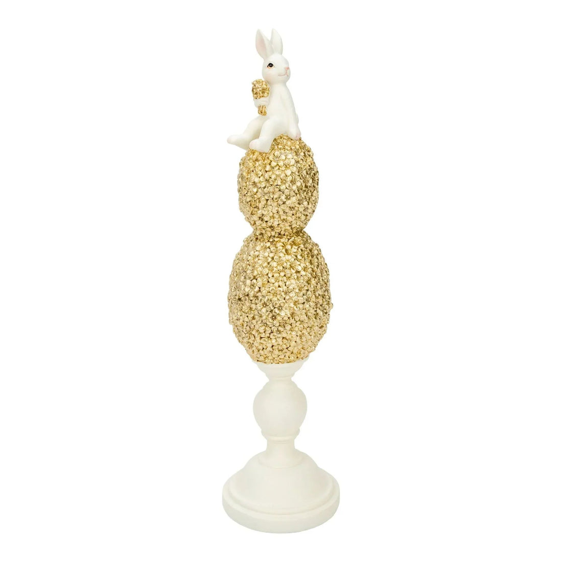 White bunny figurine perched atop gold floral egg stack on pedestal, elegant home décor accent