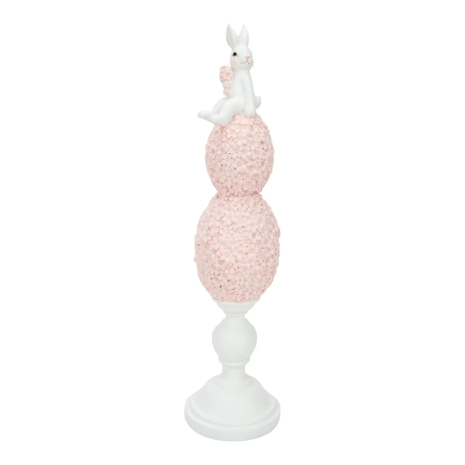 White bunny figurine perched atop pink floral spheres on pedestal, elegant home décor accent piece