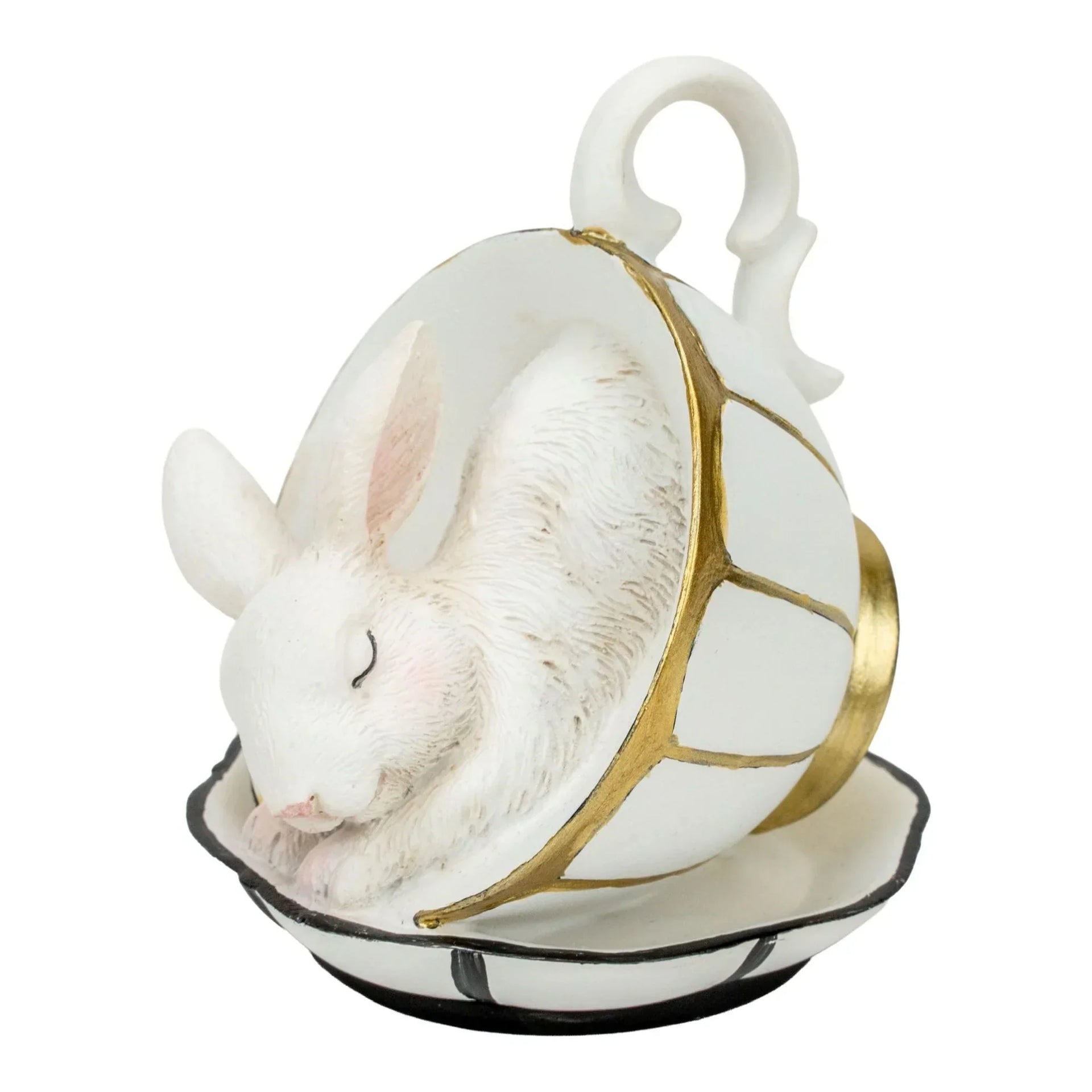 White bunny figurine nestled in a gold-accented teacup, elegant home décor accent piece