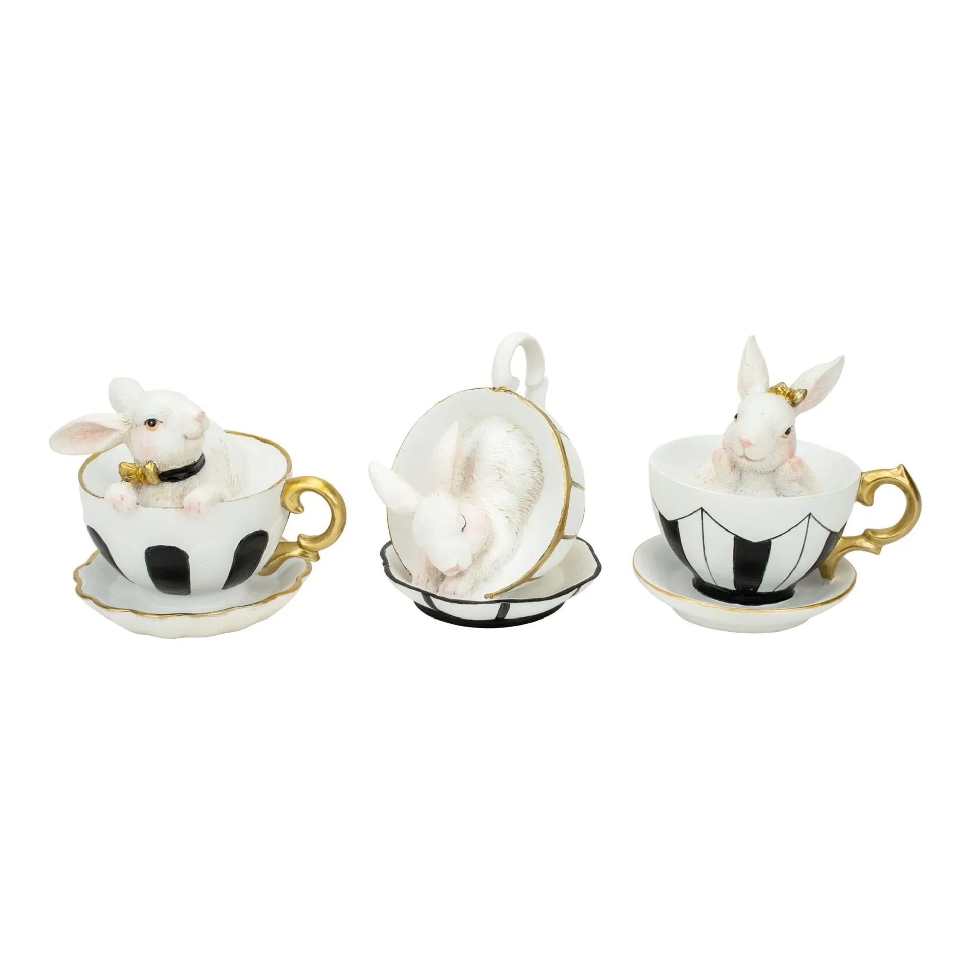 White bunny figurines in black and white teacups with gold trim, elegant home décor accents