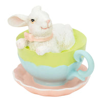 White bunny figurine in pastel teacup with pink bow, cute home decor accent