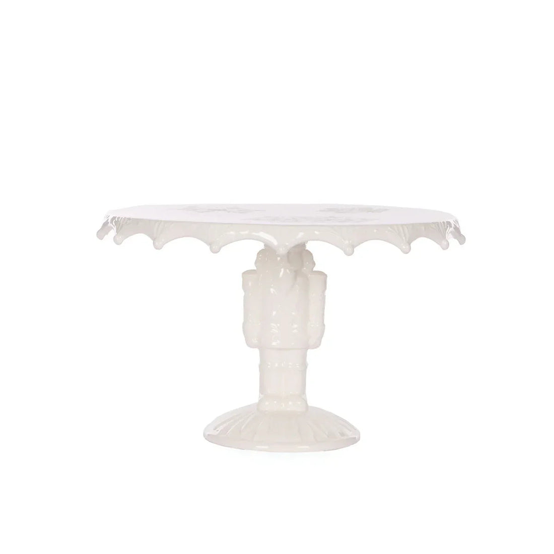 Elegant white ceramic cake stand with scalloped edge and ornate pedestal base, perfect for vintage home décor