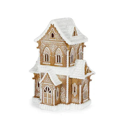 Gingerbread house decoration with snow-dusted roof and ornate icing details, perfect for holiday home décor