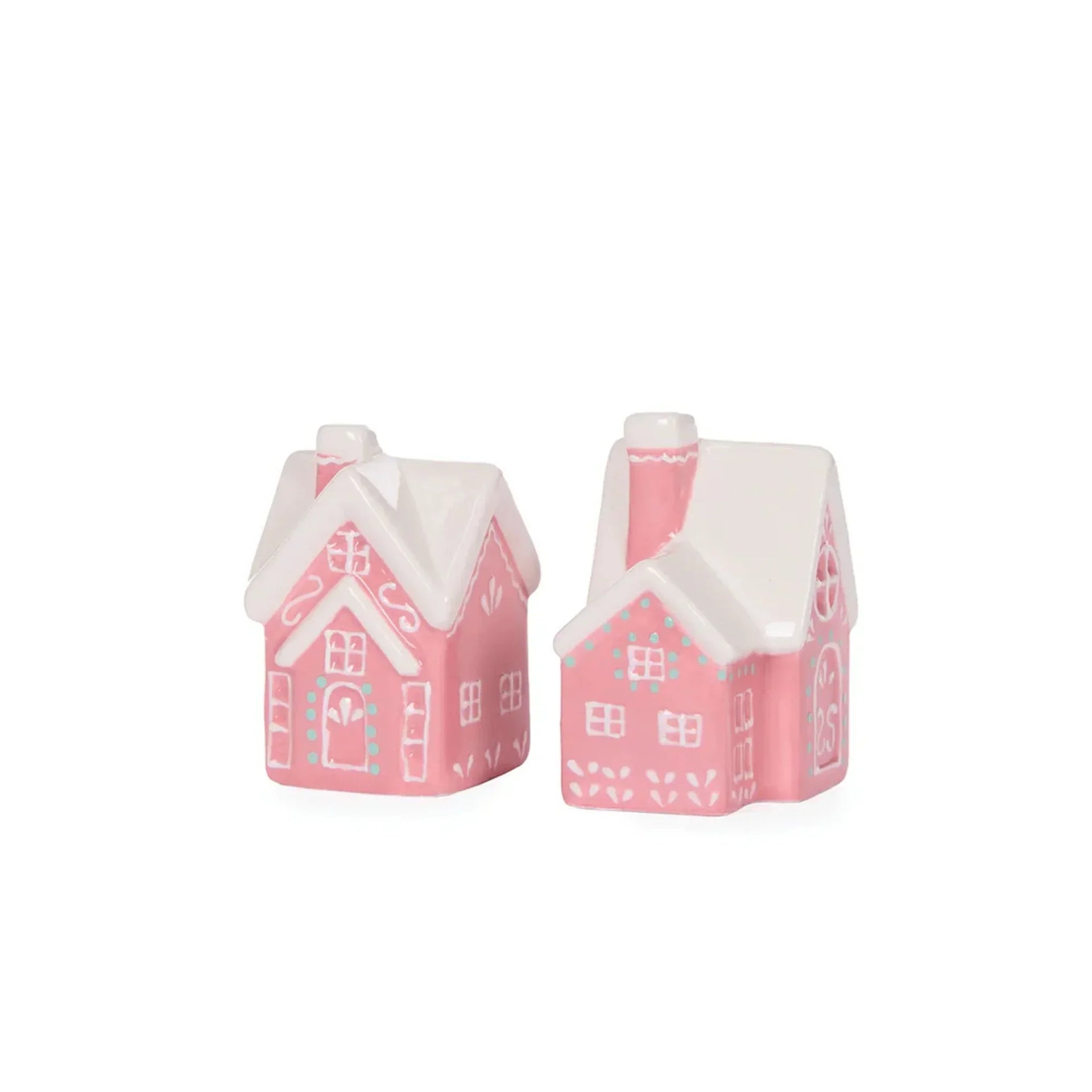 Pink ceramic gingerbread house ornaments with white roofs, perfect for festive home décor and holiday styling.