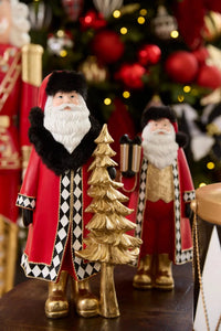 Festive Santa figurine with gold tree, red coat, black fur trim, and harlequin pattern, holiday home décor