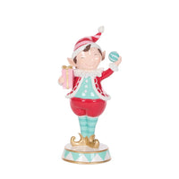 Cheerful Christmas elf figurine holding gift and ornament, festive home décor accent