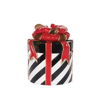 Black and white striped gift box with red ribbon and bow, elegant home décor accent