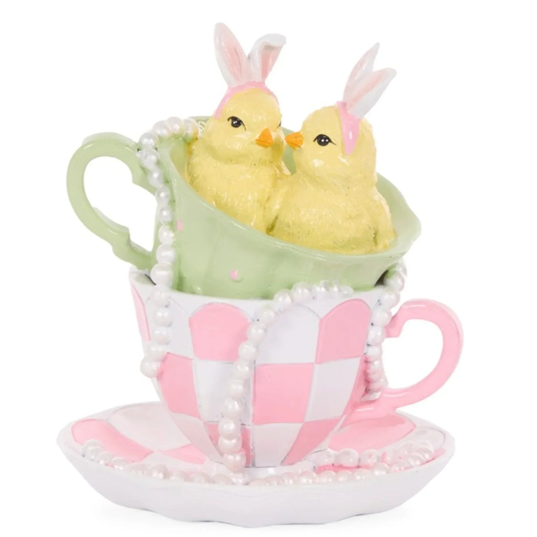 Charming Easter chick figurines with bunny ears nestled in stacked pastel teacups, perfect for spring home décor