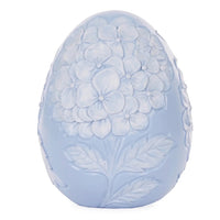 Pale blue ceramic egg with embossed hydrangea flowers and leaves, elegant home décor accent piece