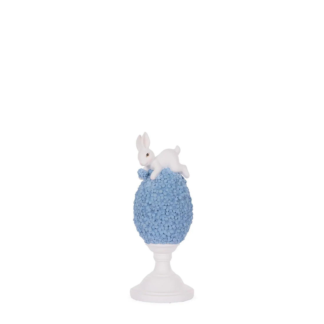 White bunny figurine perched on blue floral egg, elegant home décor accent piece