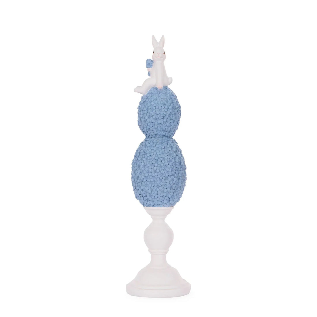 White bunny figurine perched atop blue floral spheres on pedestal, elegant home décor accent piece