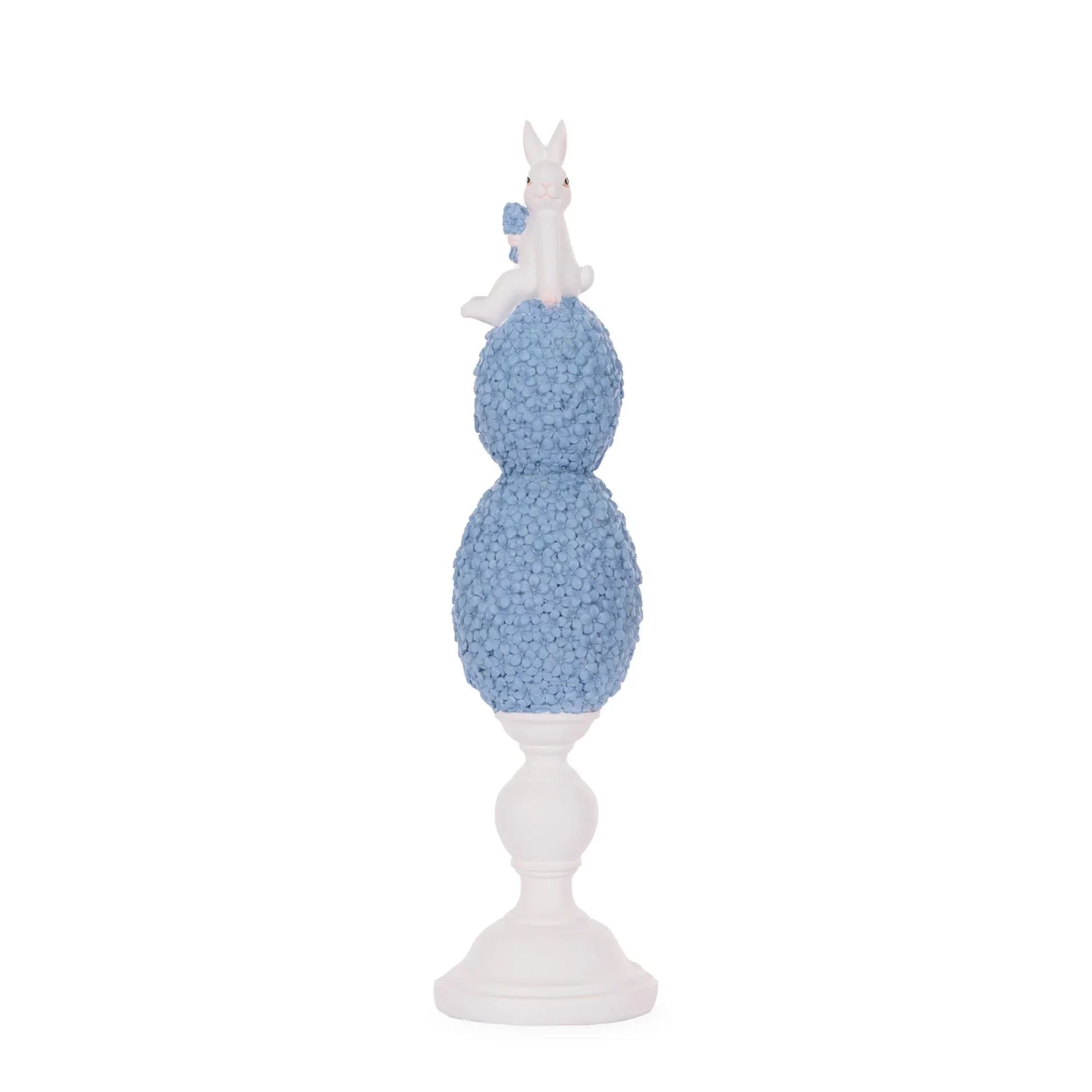 White bunny figurine perched atop blue floral spheres on pedestal, elegant home décor accent piece