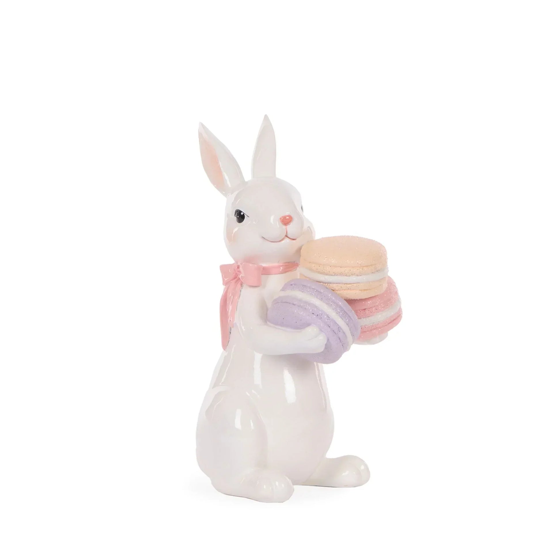 White ceramic bunny figurine holding pastel macarons, pink bow accent, Easter home decor